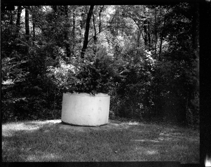 Black and white photograph of a concrete planter